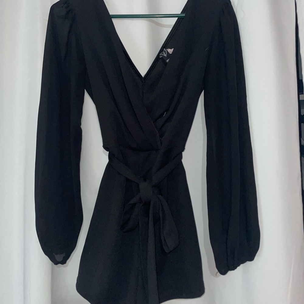 Black long sleeve, v neck romper with a tie